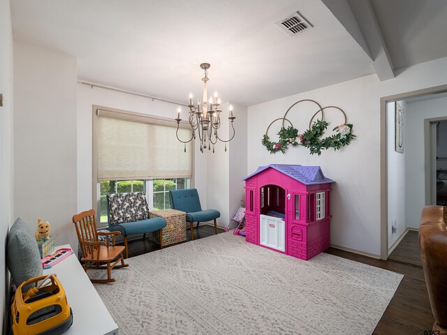 4922 Leaning Oaks Dr, Flint, TX 75762 - sitting room with dark wood-style flooring, a chandelier, and baseboards