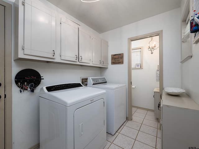 4922 Leaning Oaks Dr, Flint, TX 75762 - laundry room with cabinet space, washing machine and dryer, and light tile patterned floors