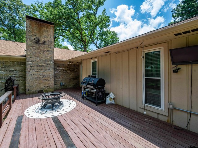 4922 Leaning Oaks Dr, Flint, TX 75762 - wooden terrace with grilling area