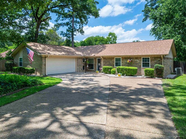 4922 Leaning Oaks Dr, Flint, TX 75762 - ranch-style home with cooling unit, driveway, and brick siding
