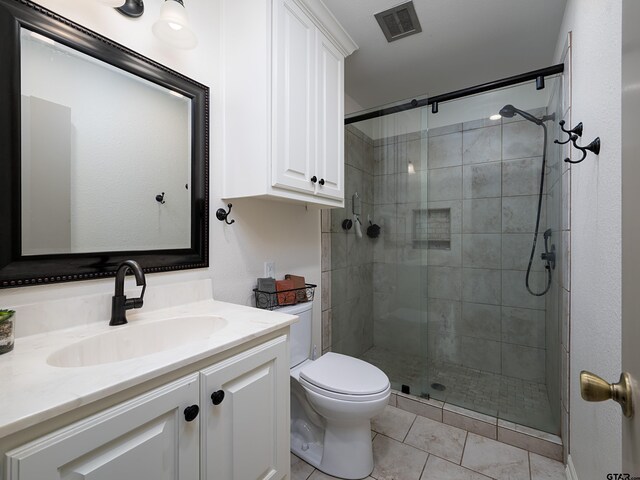 4922 Leaning Oaks Dr, Flint, TX 75762 - bathroom featuring vanity, toilet, a shower stall, and tile patterned flooring