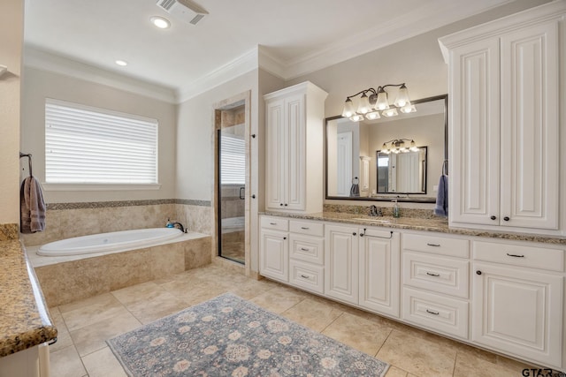 full bathroom featuring vanity, visible vents, a shower stall, a bath, and crown molding