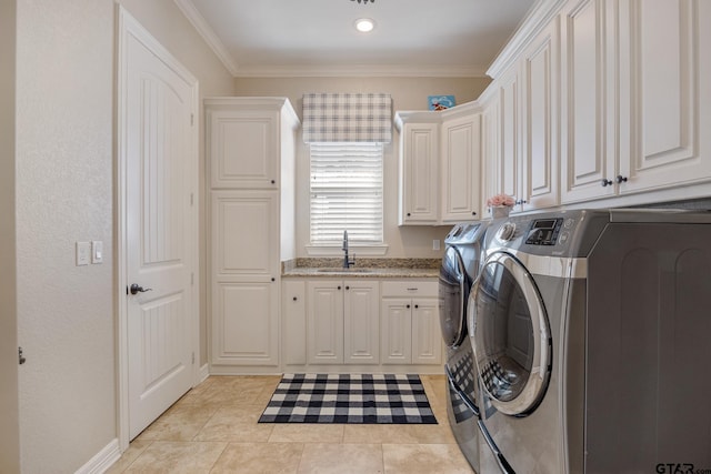 laundry room featuring cabinet space, washer and clothes dryer, ornamental molding, a sink, and light tile patterned flooring