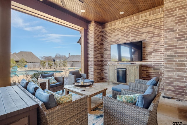 view of patio / terrace with an outdoor living space and a fenced in pool