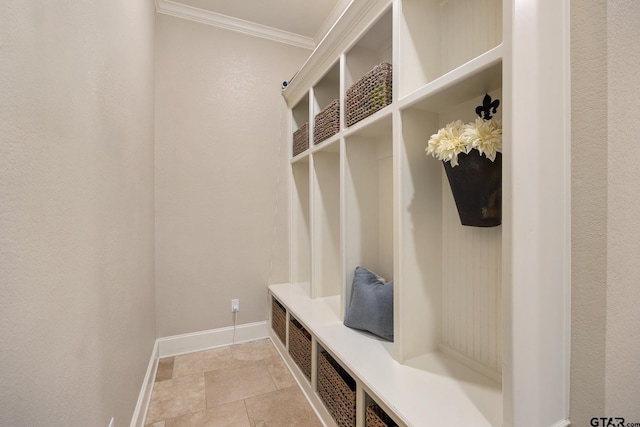 mudroom featuring crown molding and baseboards