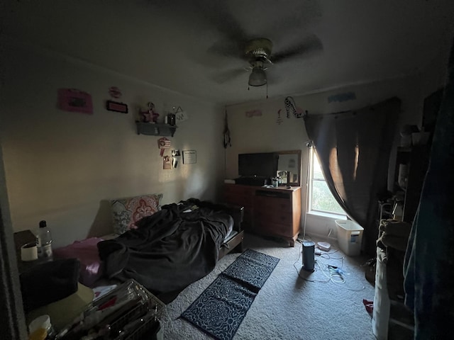 bedroom featuring light carpet and ceiling fan