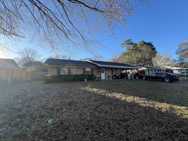 ranch-style home with covered porch