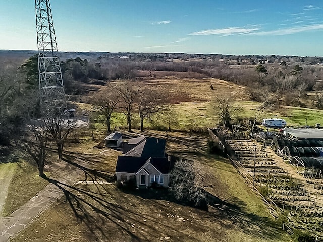 birds eye view of property with a rural view