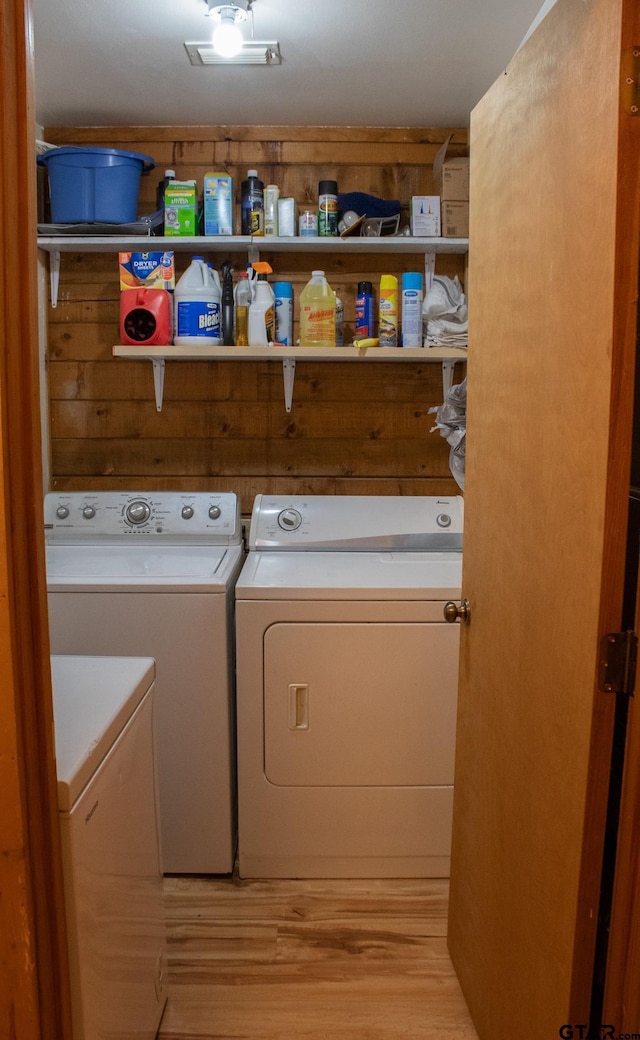 21544 Birch Pl, Tyler, TX 75705 - washroom featuring washer and clothes dryer and wood finished floors