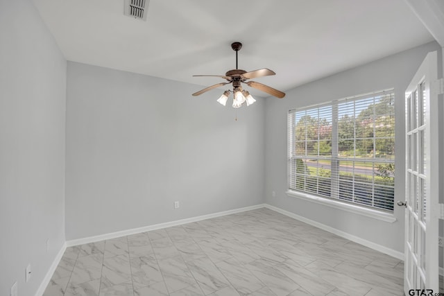 spare room with ceiling fan