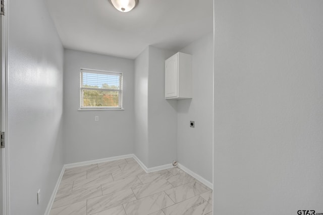 washroom with cabinets and hookup for an electric dryer