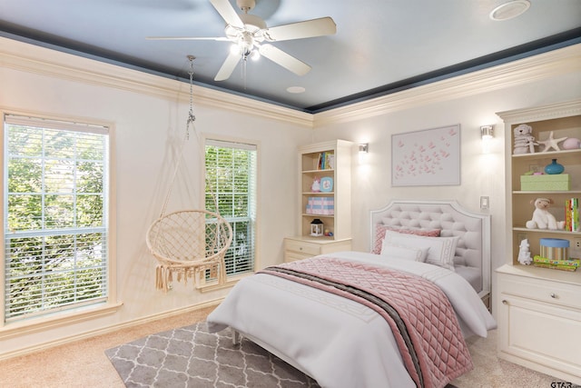 bedroom with carpet, crown molding, and ceiling fan