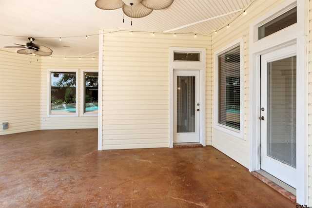property entrance with ceiling fan and a patio