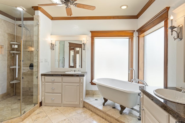 full bath featuring a shower stall, vanity, crown molding, a freestanding tub, and ceiling fan