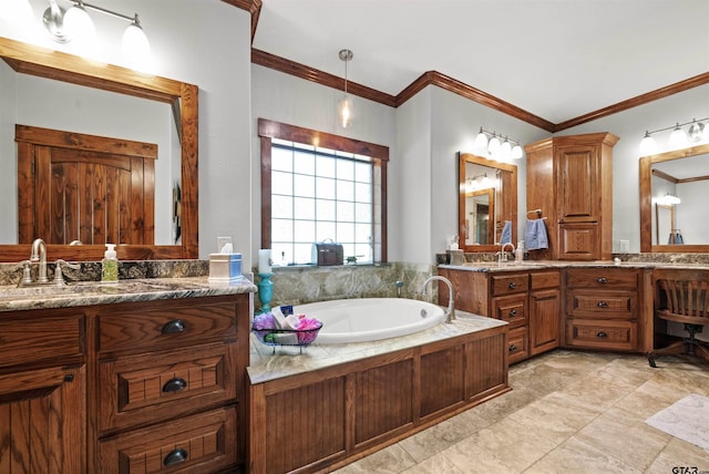 bathroom featuring a tub, vanity, and crown molding