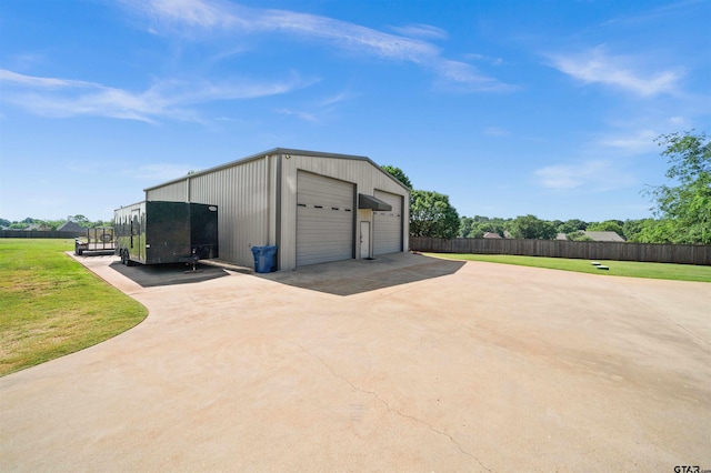 garage with a yard