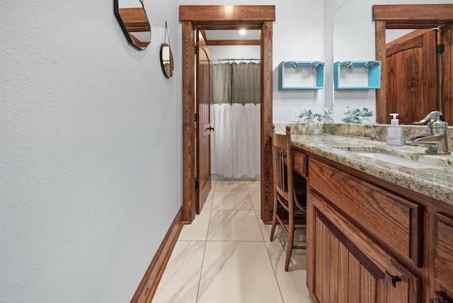 bathroom with vanity, crown molding, and a shower with curtain