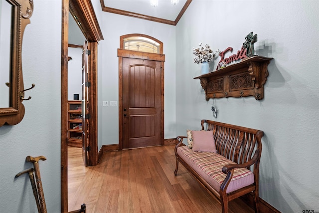 interior space featuring ornamental molding and hardwood / wood-style floors