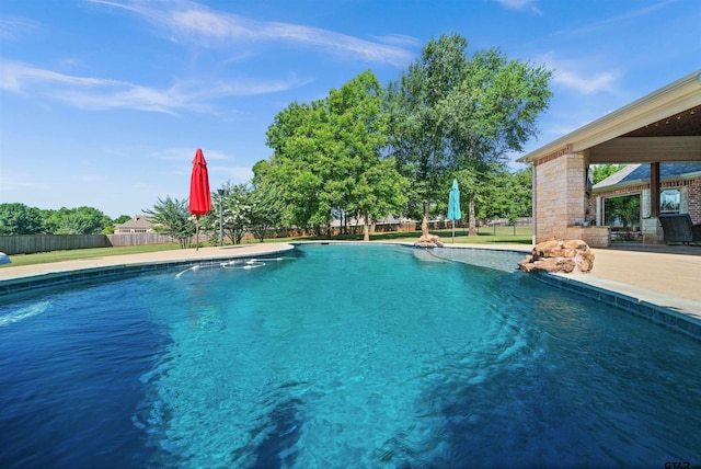 view of swimming pool with a patio area