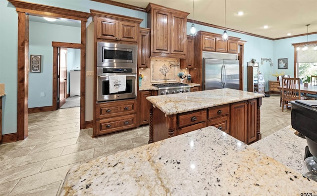 kitchen featuring built in appliances, hanging light fixtures, ornamental molding, and light stone counters