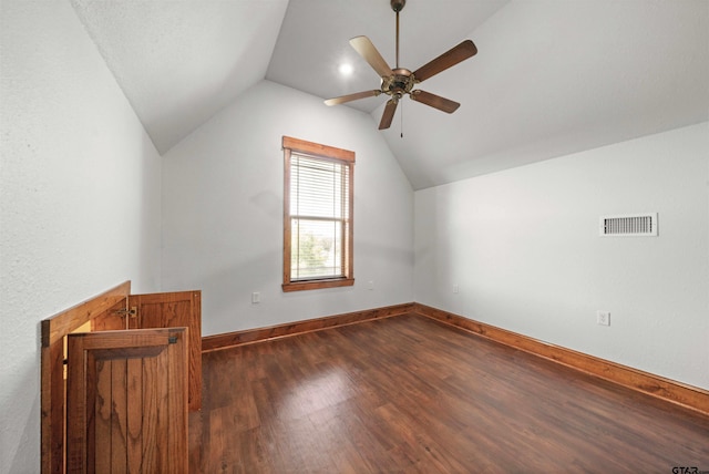 bonus room with dark wood-type flooring, lofted ceiling, and ceiling fan