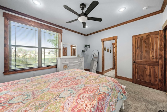 bedroom with ornamental molding, light colored carpet, and ceiling fan