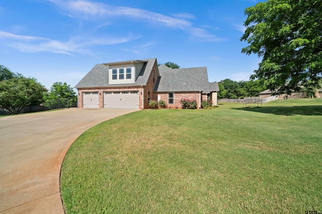 view of front facade with a garage and a front lawn