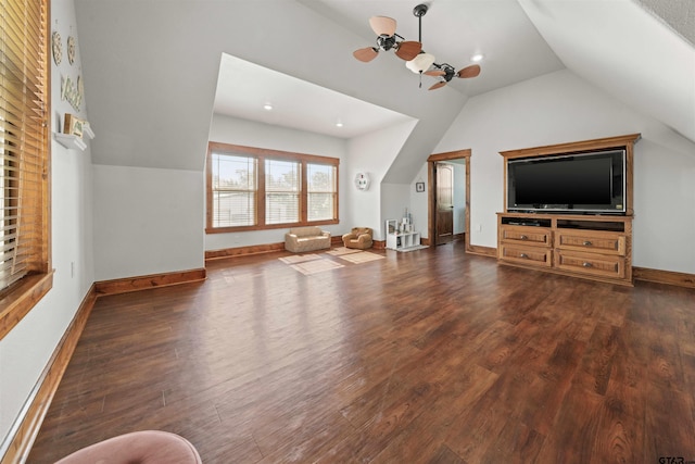 unfurnished living room featuring dark hardwood / wood-style flooring, ceiling fan, and vaulted ceiling