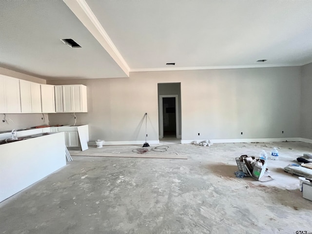 unfurnished living room featuring crown molding