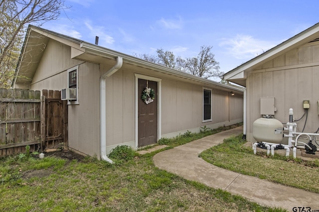 exterior space with a lawn and cooling unit