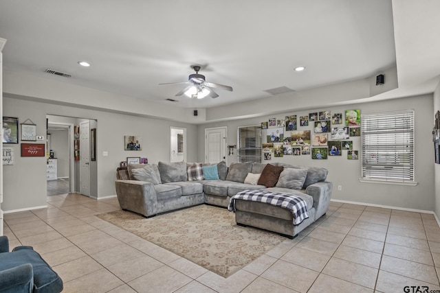 living room featuring ceiling fan and light tile patterned floors