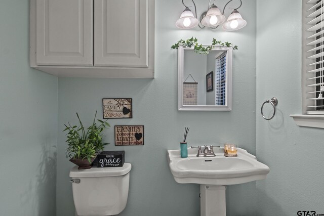 bathroom with toilet and sink