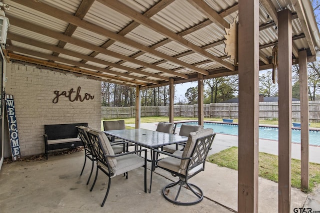 view of patio with a fenced in pool