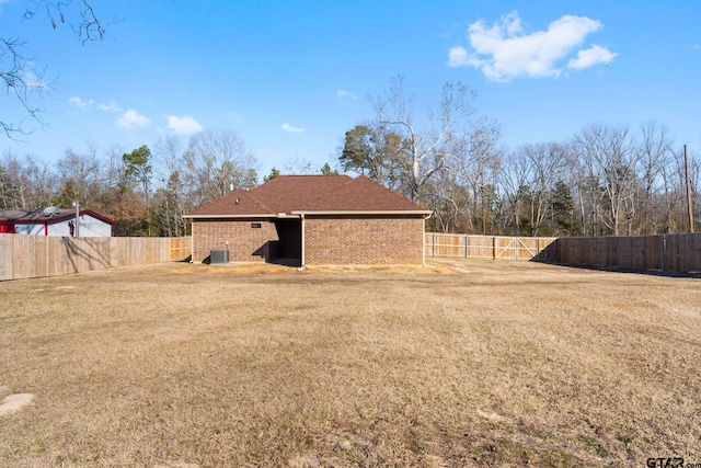 exterior space with a lawn and central air condition unit