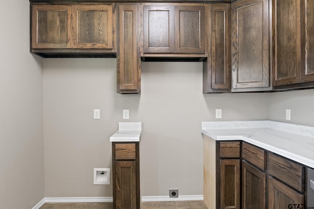kitchen with dark brown cabinets and baseboards