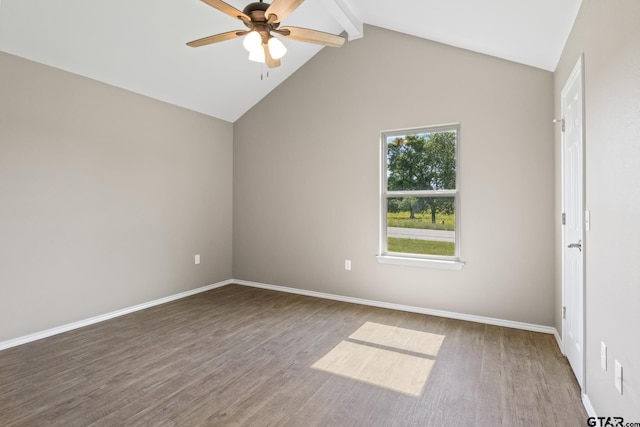 empty room with wood finished floors, a ceiling fan, and baseboards