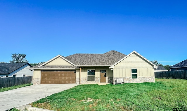 view of front of house with stone siding, driveway, an attached garage, and board and batten siding