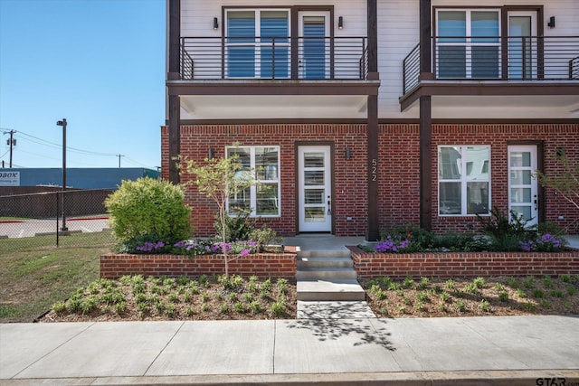 view of front of property with a balcony