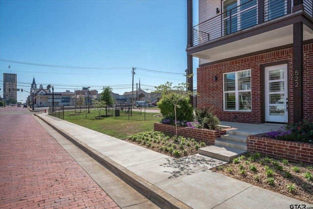 view of yard with a balcony