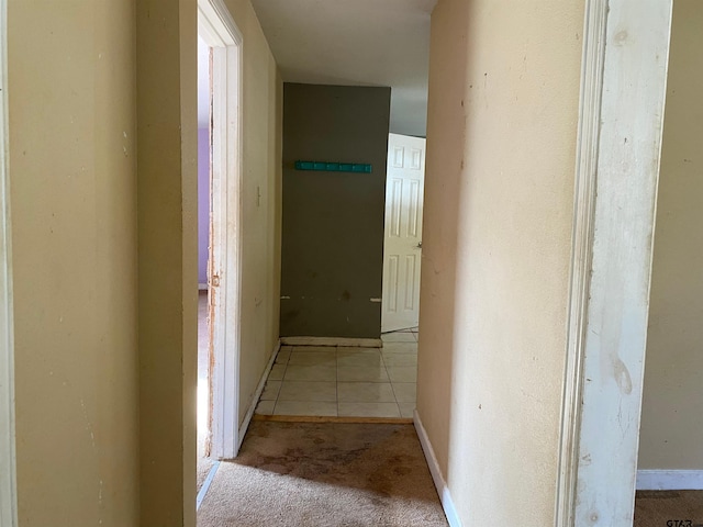 corridor featuring light tile patterned floors