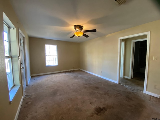 spare room with ceiling fan and carpet floors