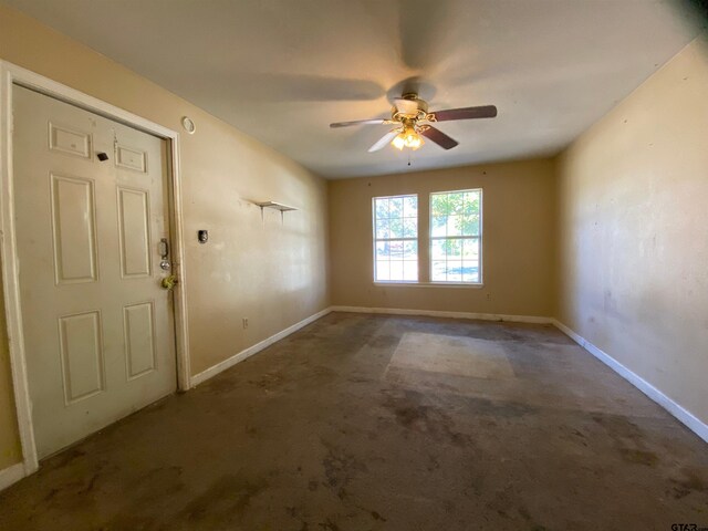 unfurnished room with ceiling fan