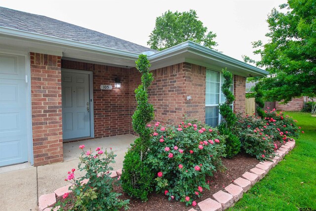 105 Ash Dr, Bullard, TX 75757 - entrance to property featuring brick siding and roof with shingles