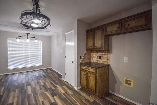 105 Ash Dr, Bullard, TX 75757 - kitchen with tasteful backsplash, dark wood-type flooring, baseboards, and hanging light fixtures