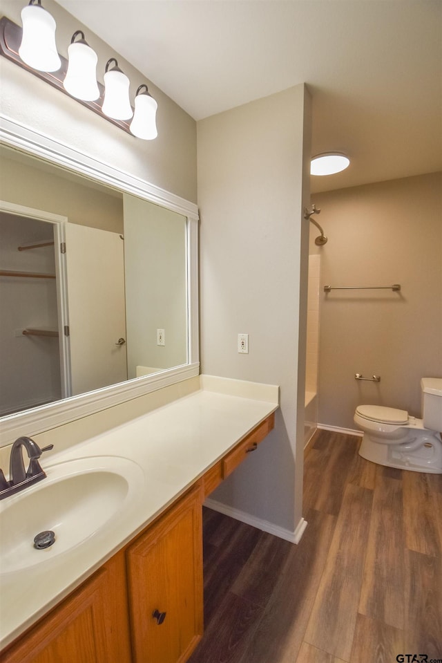 105 Ash Dr, Bullard, TX 75757 - full bathroom featuring toilet, wood finished floors, vanity, and bathing tub / shower combination