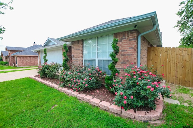 105 Ash Dr, Bullard, TX 75757 - view of side of property with a garage, brick siding, and driveway