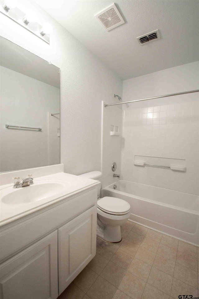 bathroom featuring visible vents, shower / washtub combination, toilet, and vanity