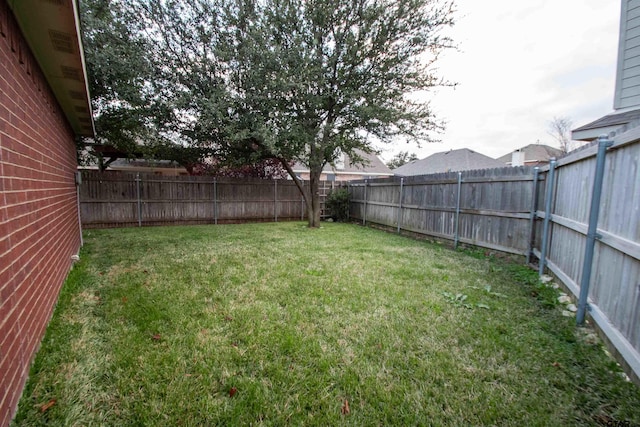 view of yard featuring a fenced backyard