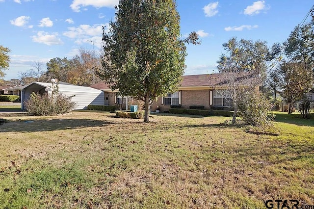 rear view of house featuring a lawn