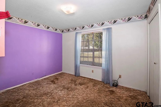 empty room featuring carpet flooring